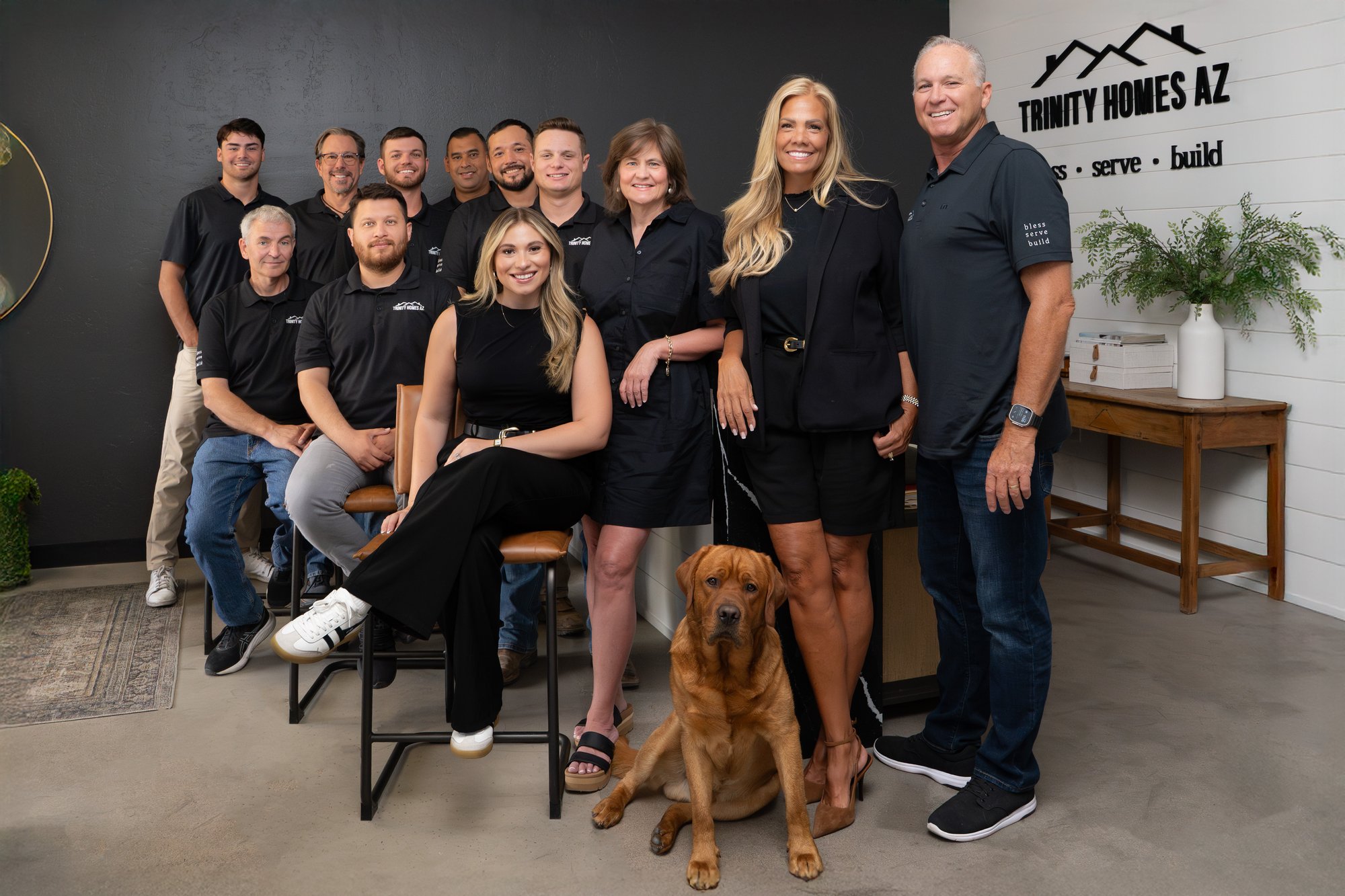 The full Trinity Homes Remodeling team together, including Hank the office dog