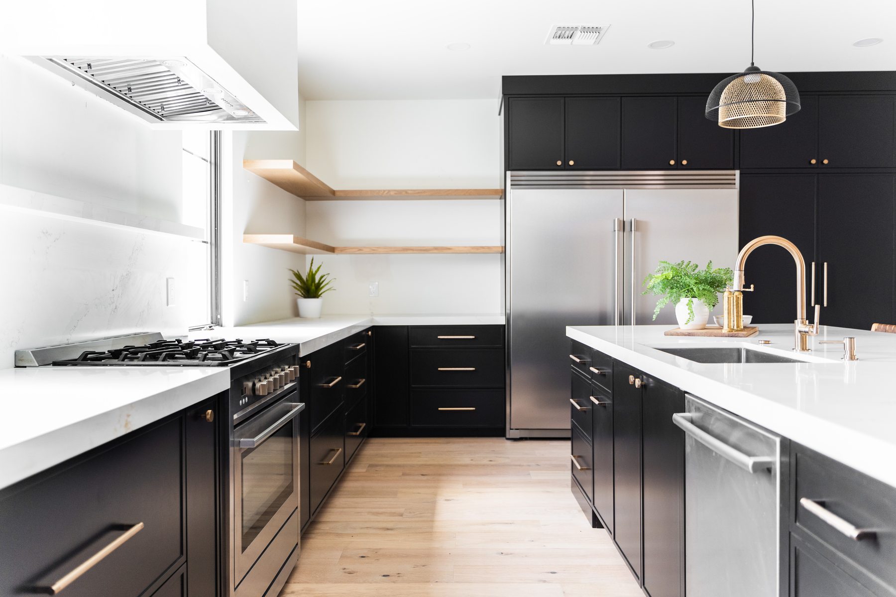 Full kitchen view with black cabinetry, Arcadia whole-home remodel