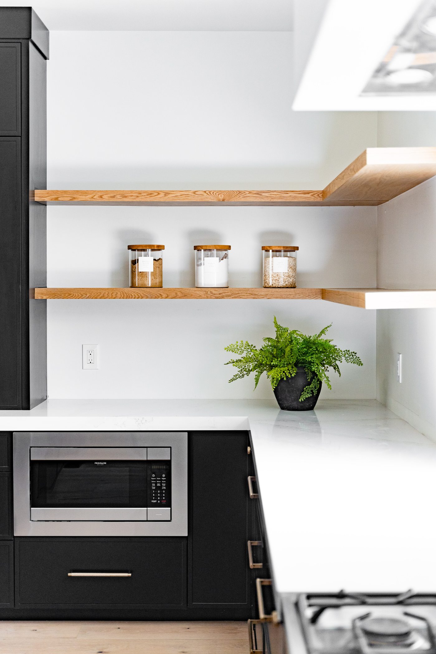 Kitchen with black cabinetry and open wood shelving, Arcadia whole-home remodel