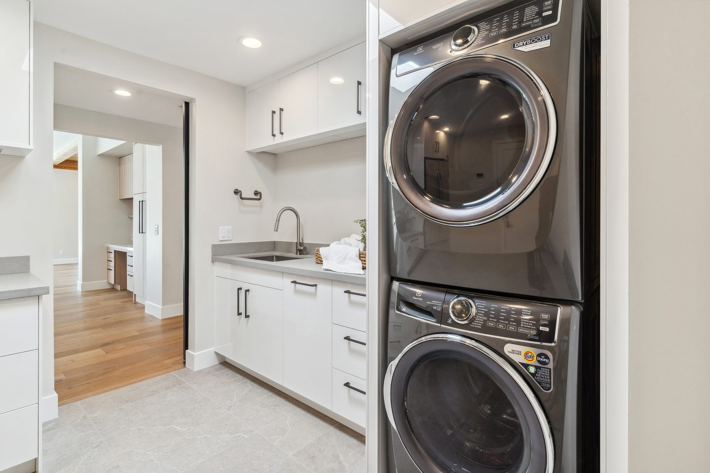 Laundry room with white cabinetry, Paradise Valley whole-home remodel