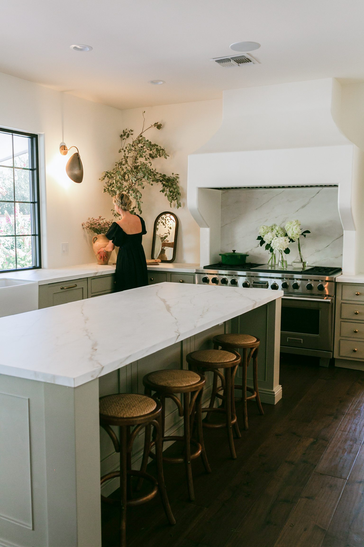 Kitchen with sage green cabinetry and marble island, Scottsdale whole-home remodel