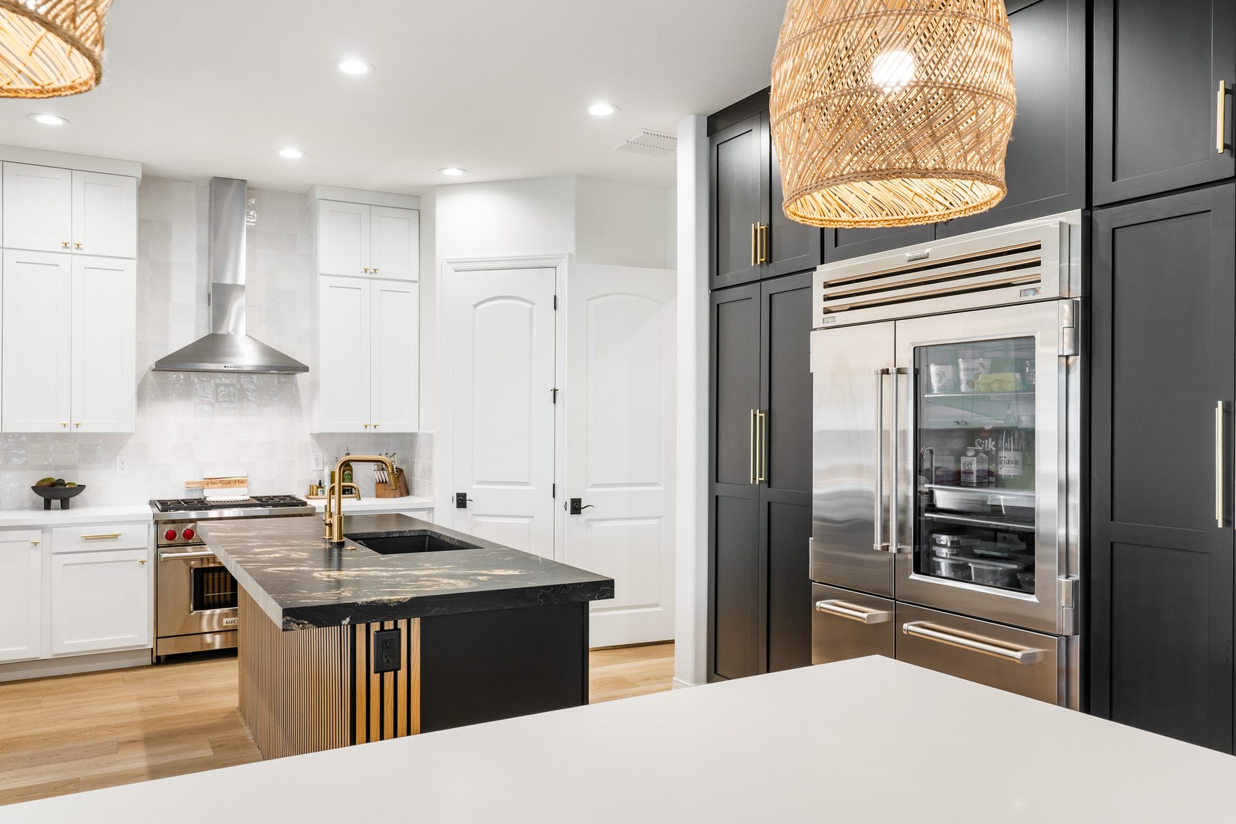 Full kitchen view with black and white cabinetry, Paradise Valley partial remodel