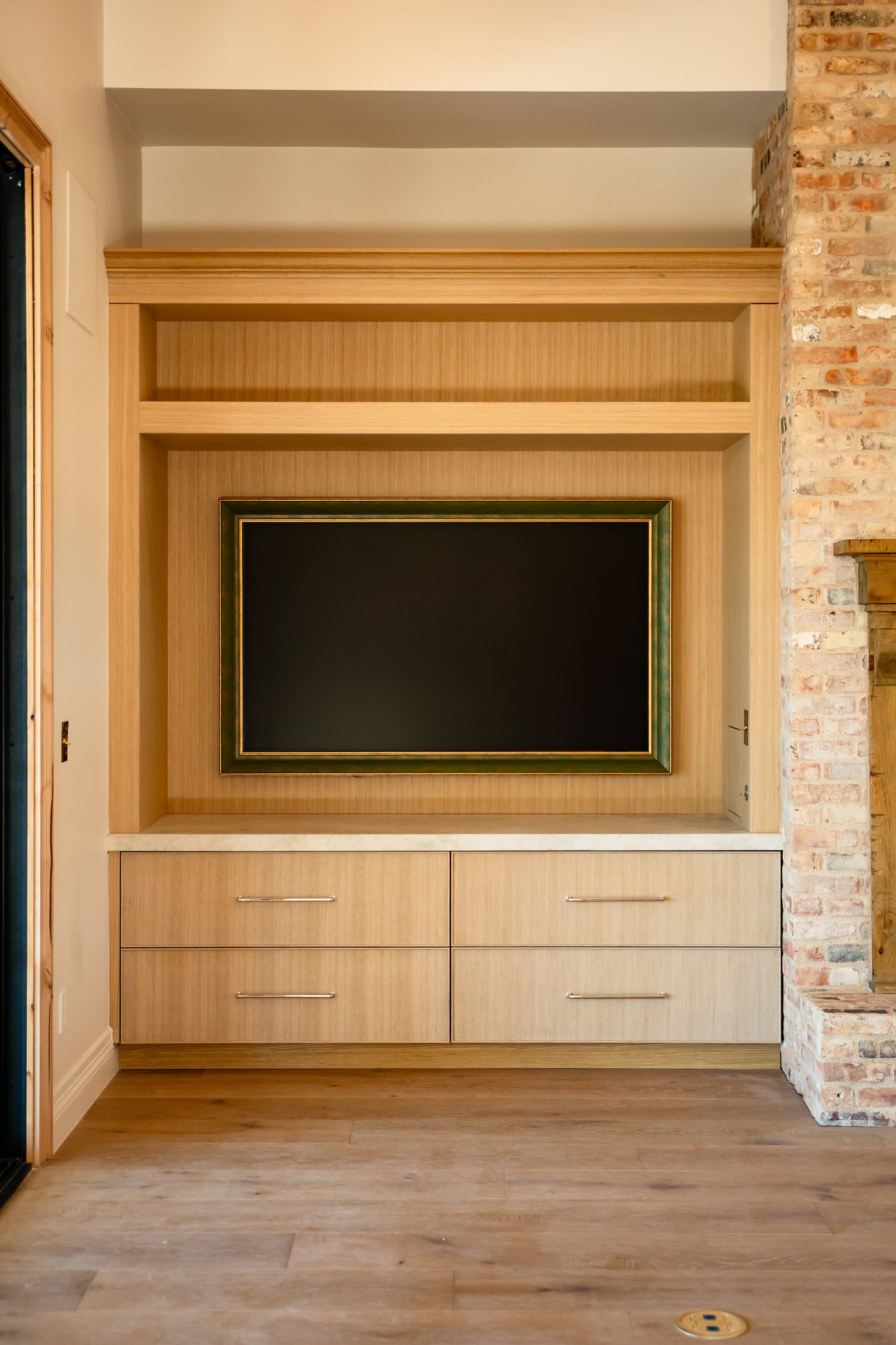 Built-in media wall with exposed brick, Paradise Valley custom home