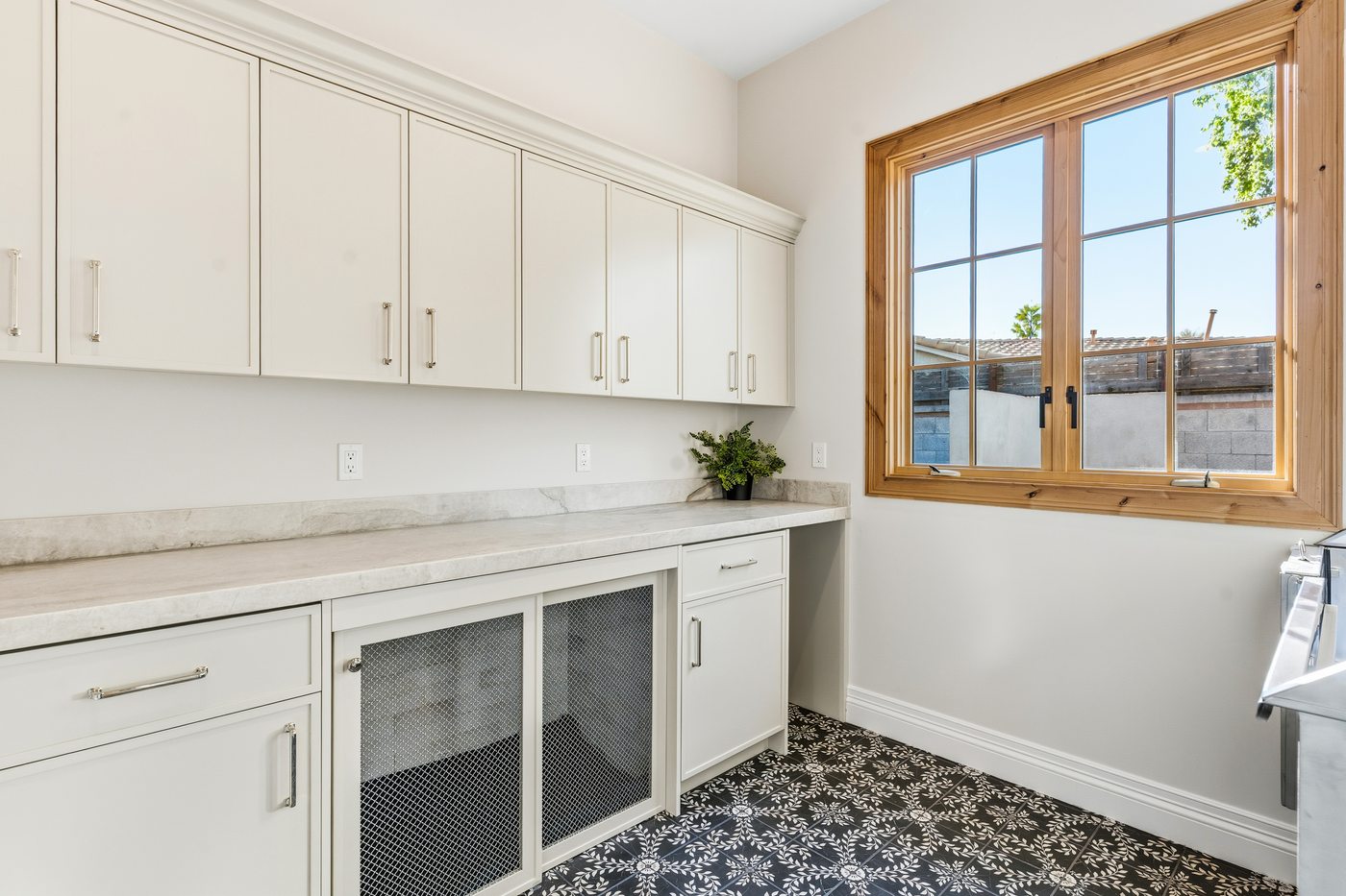 Mudroom with patterned tile floor and built-in kennel, Paradise Valley custom home