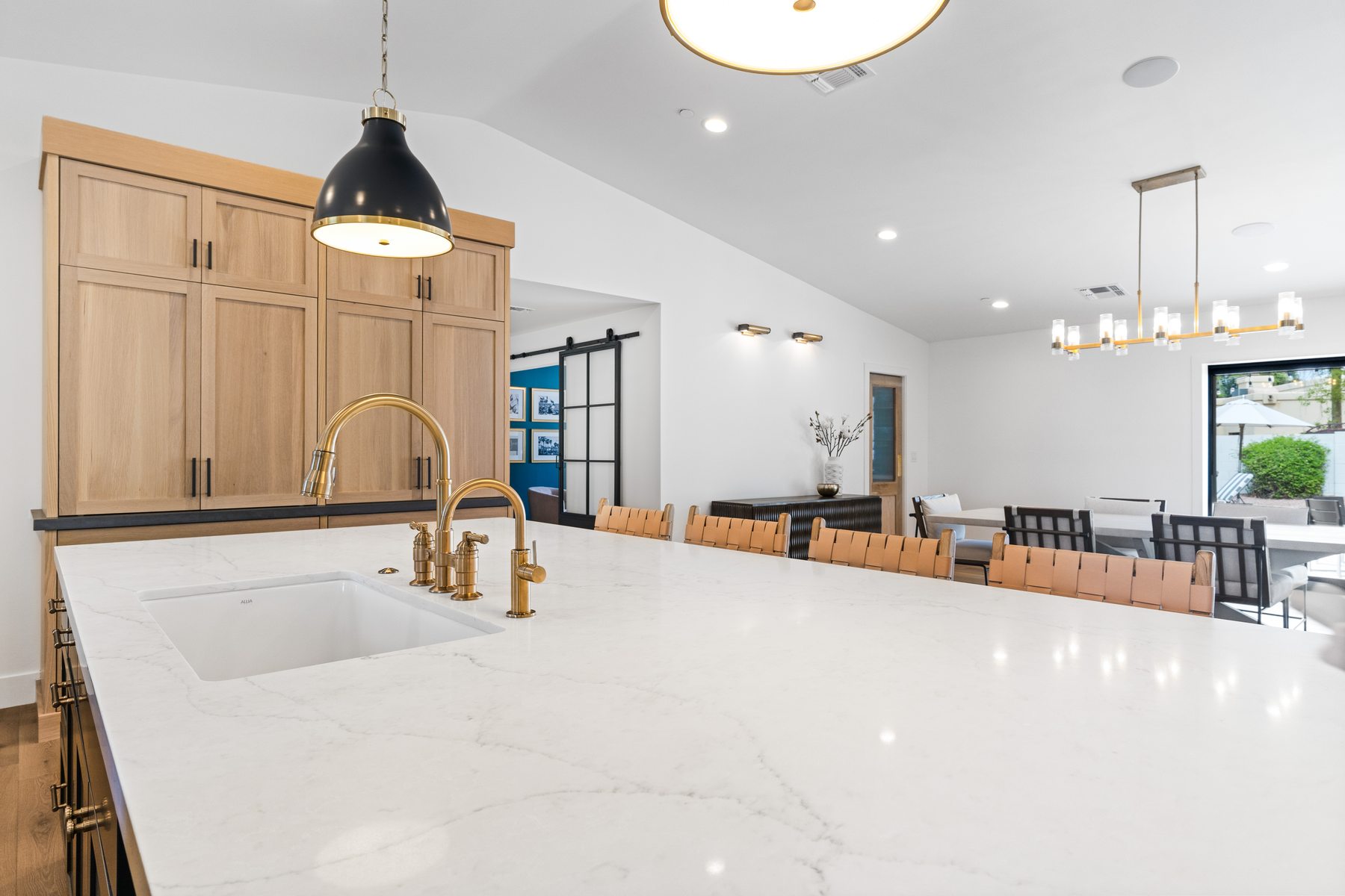 Kitchen island with marble countertop and brass fixtures, Scottsdale whole-home remodel