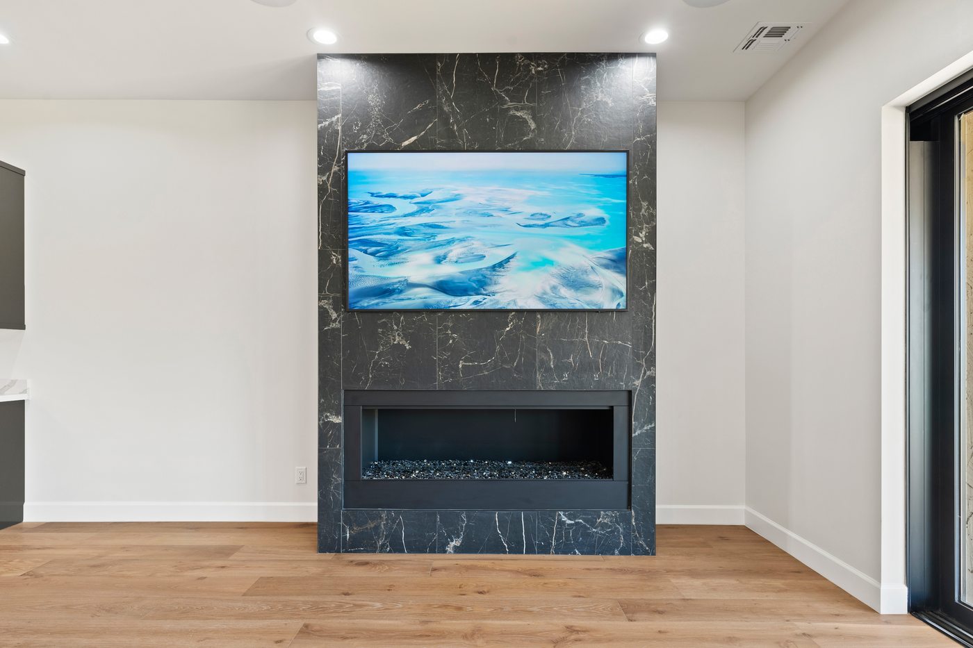Black marble fireplace and media wall, Scottsdale whole-home renovation