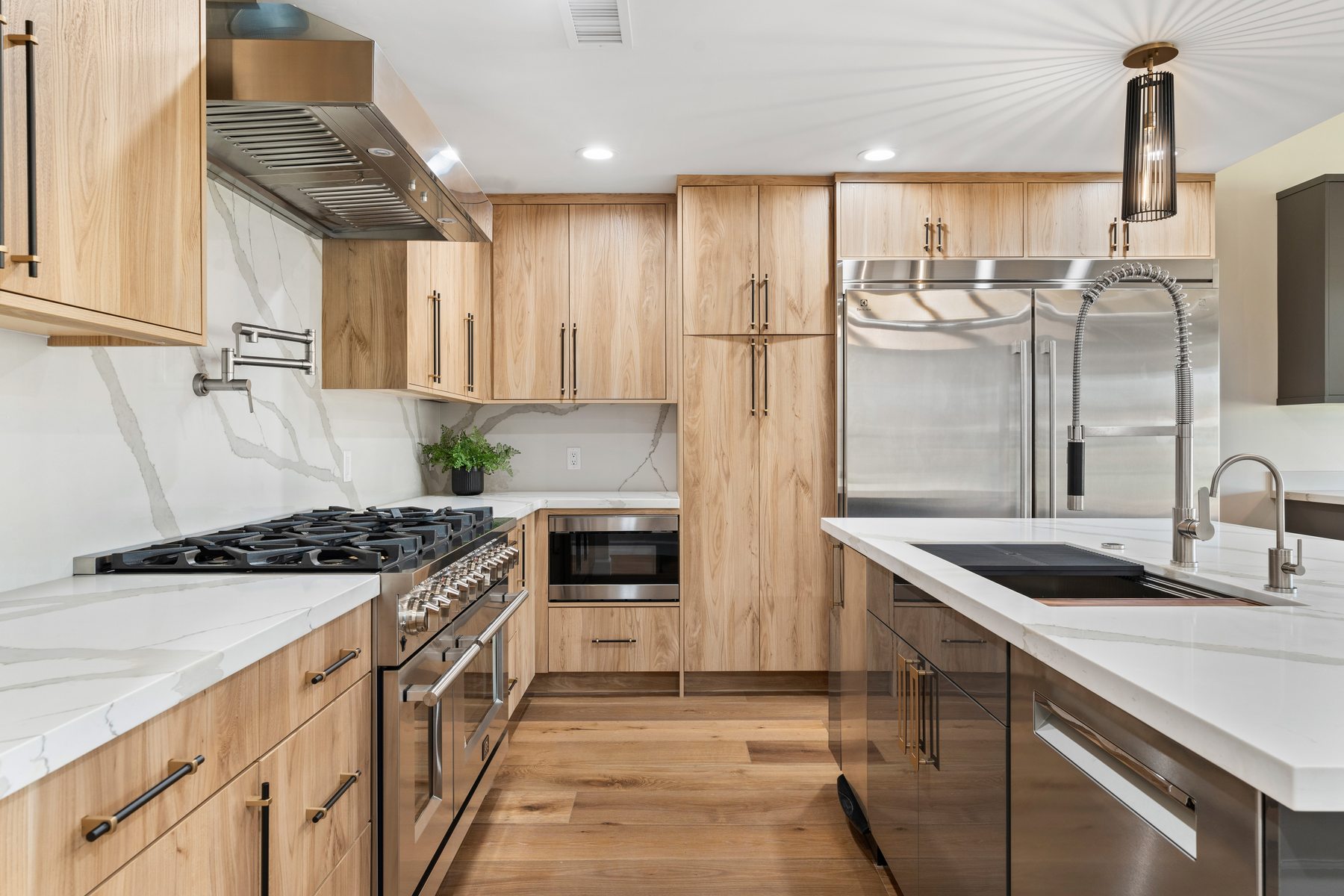Kitchen with light wood cabinetry and marble backsplash, Scottsdale whole-home renovation