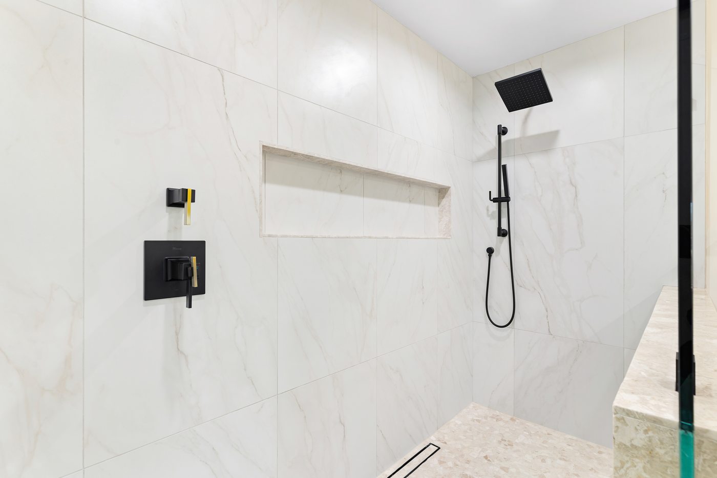 Marble shower with black fixtures, Scottsdale whole-home renovation