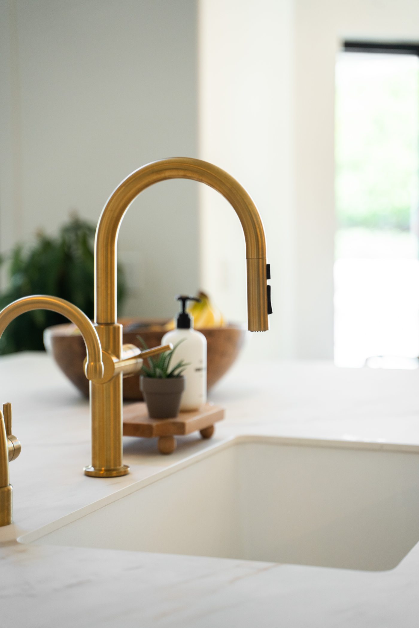 Gold faucet and sink detail, Gilbert whole-home remodel