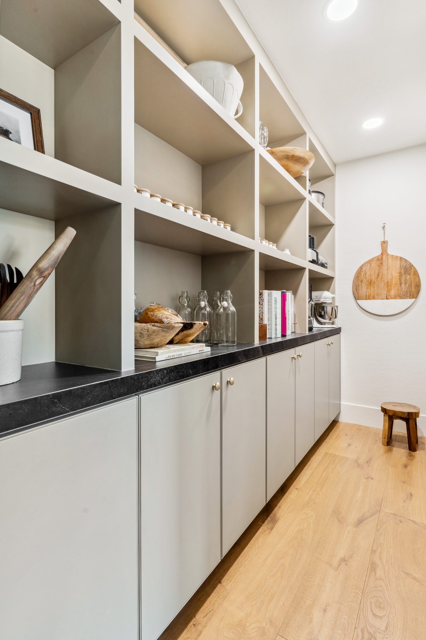 Open shelving with black countertop, Gilbert whole-home remodel