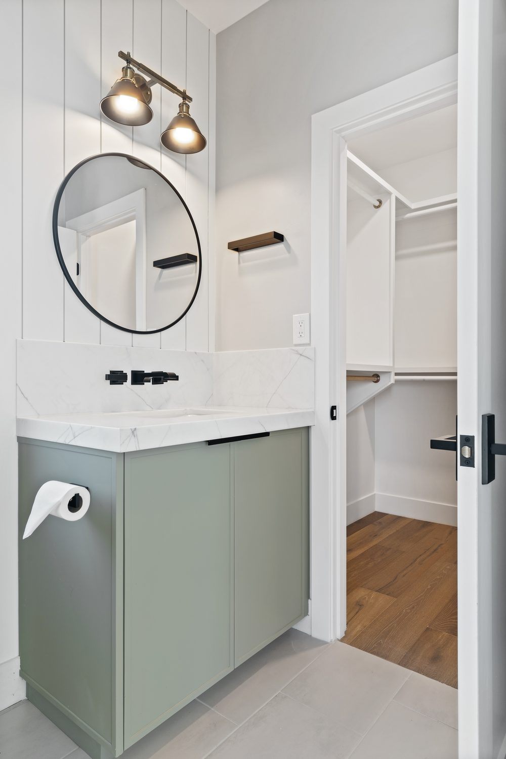 Powder bathroom with sage green vanity and round mirror, Manning residence, Scottsdale