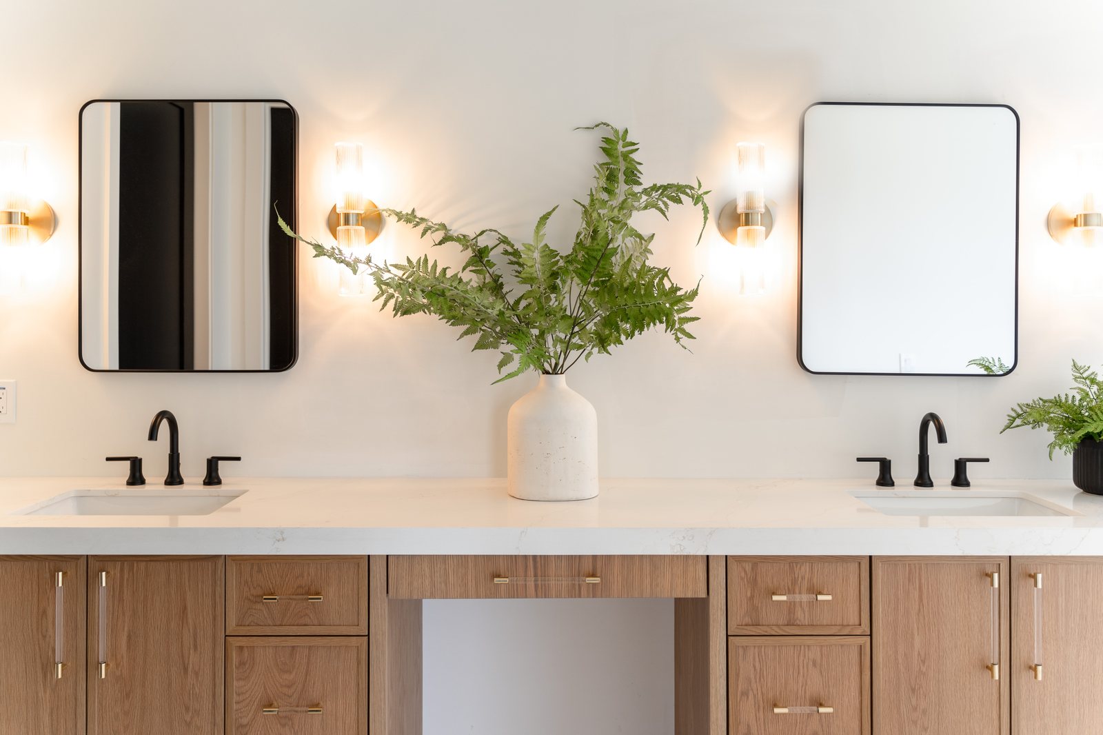 Primary bathroom with double vanity and wood cabinetry, Trinity Remodeling project